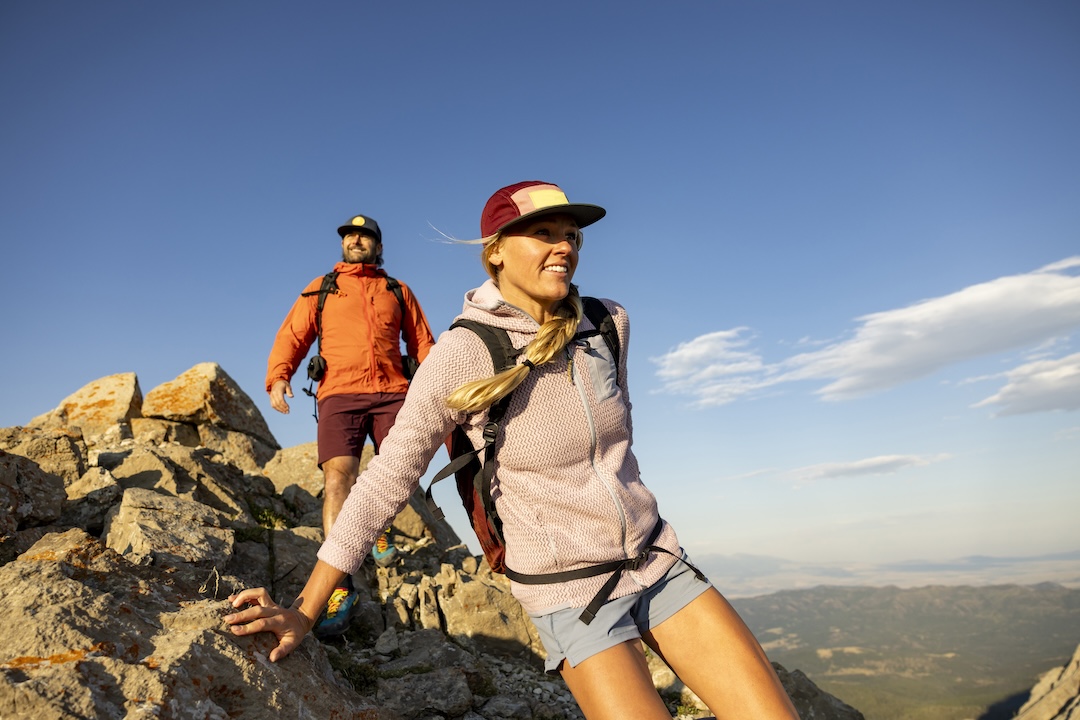 A couple enjoying a day hike in the scenic mountains of Montana.