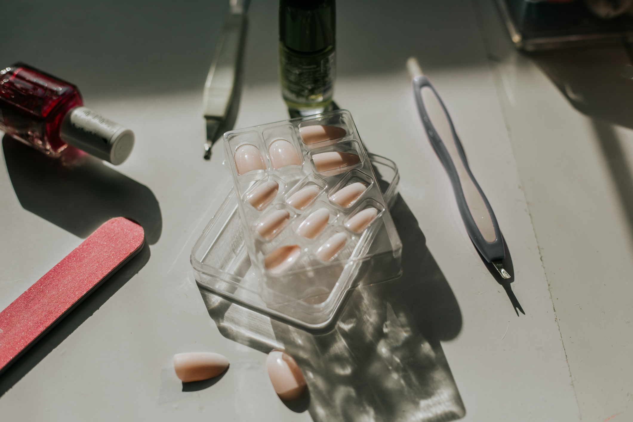 False nail kits and colorful nail polishes