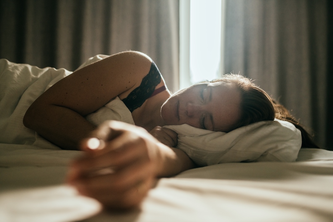 Woman sleeping well in a nice sleeping room.
