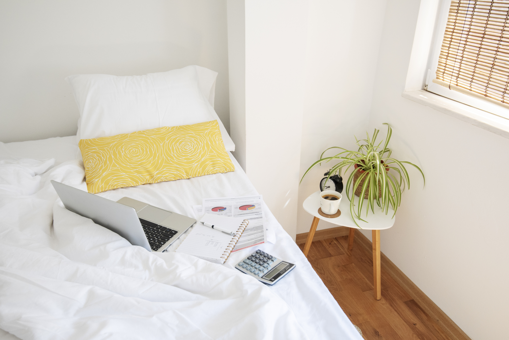 Home office. laptop computer on bed