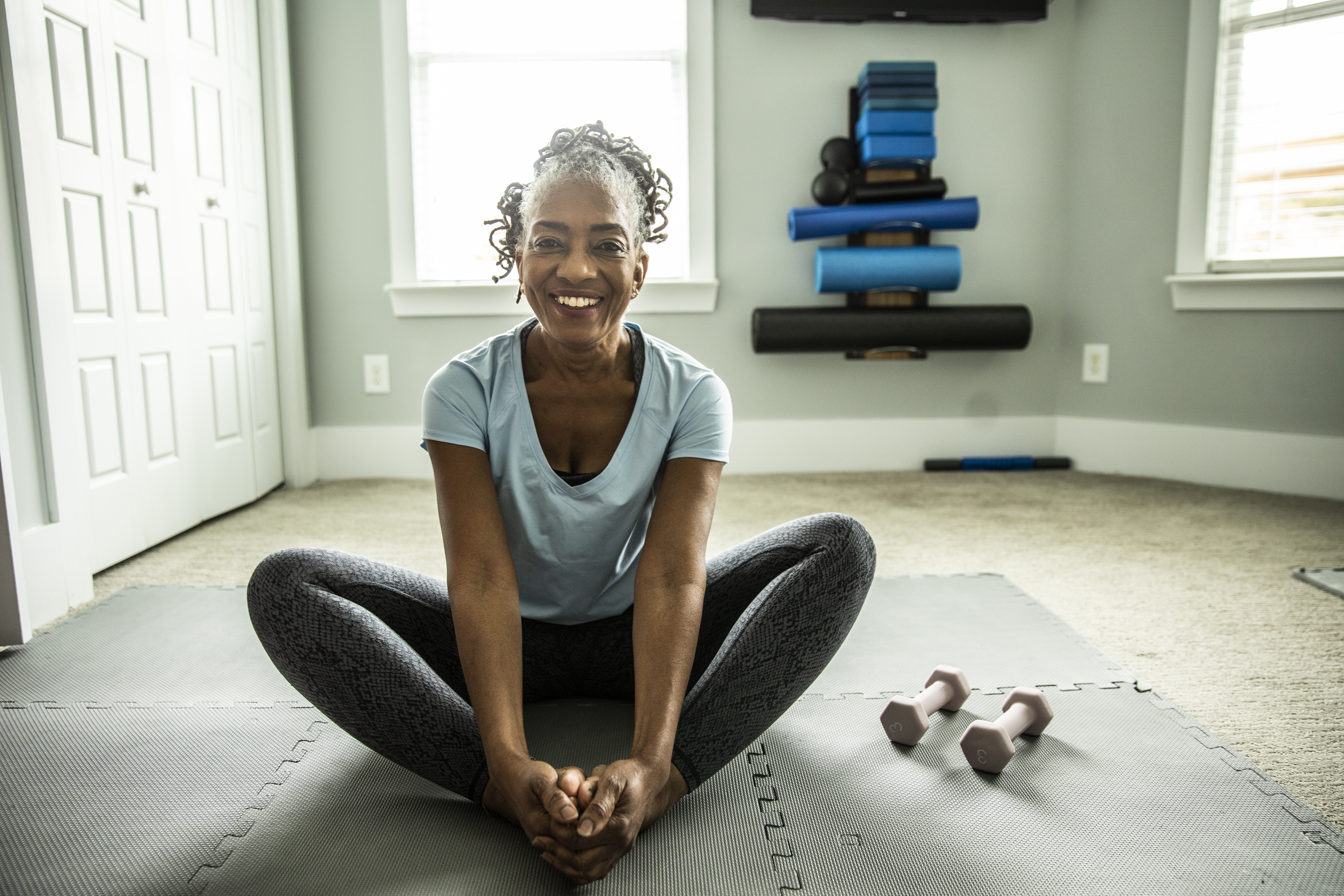 Woman exercising in home gym