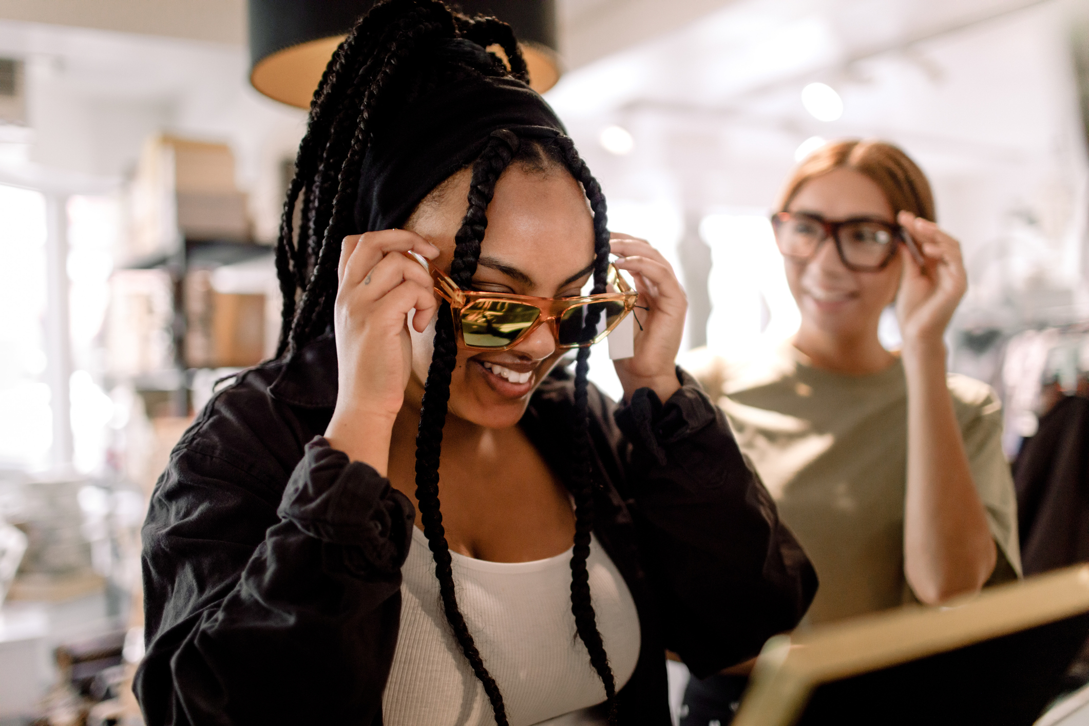 Woman trying on sunglasses