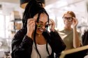 Woman trying on sunglasses
