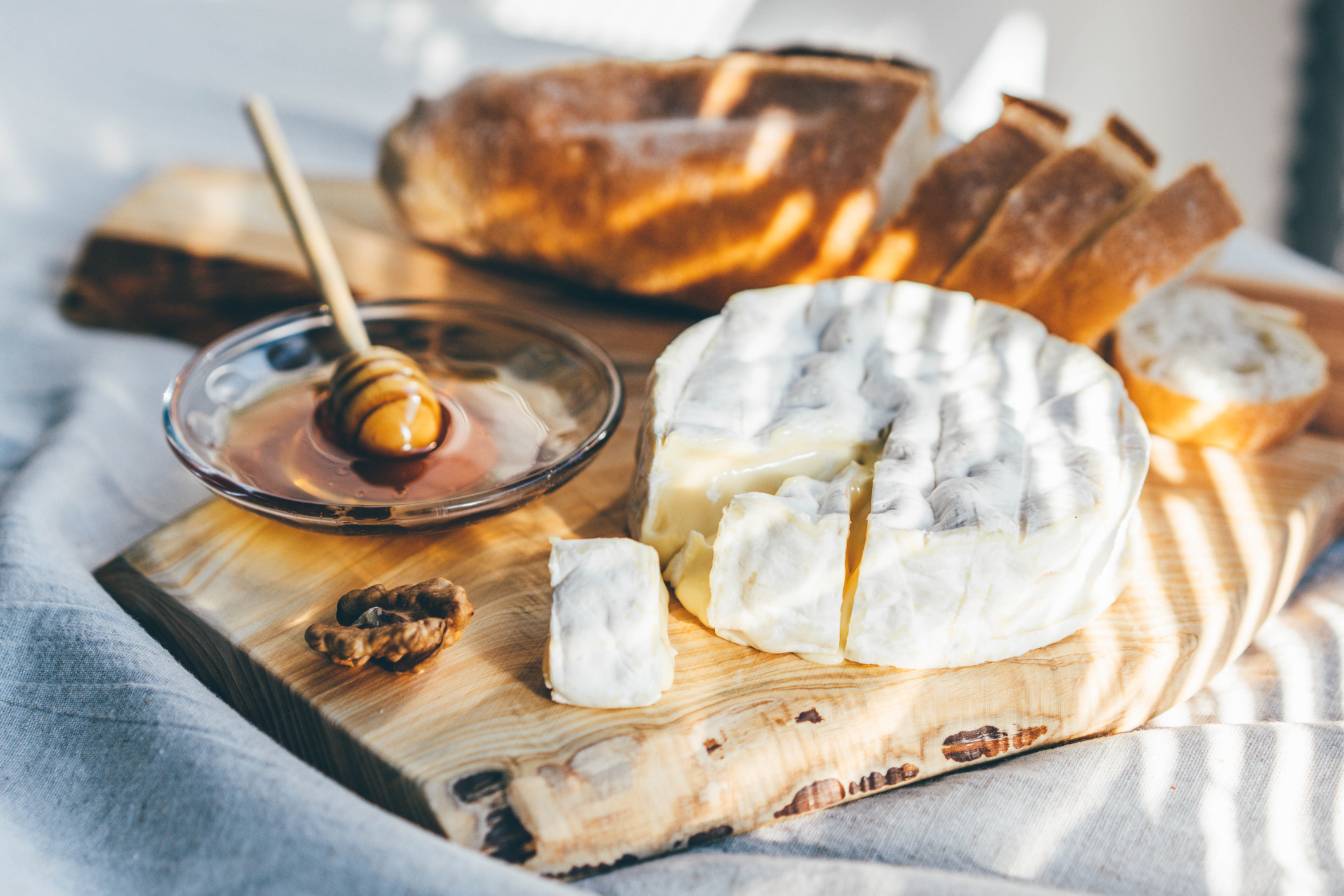 Cheese platter. Close-up of food on cutting board.