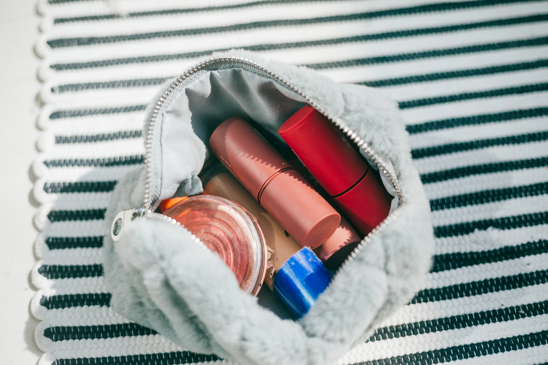 top view cosmetic make-up bag with beauty products