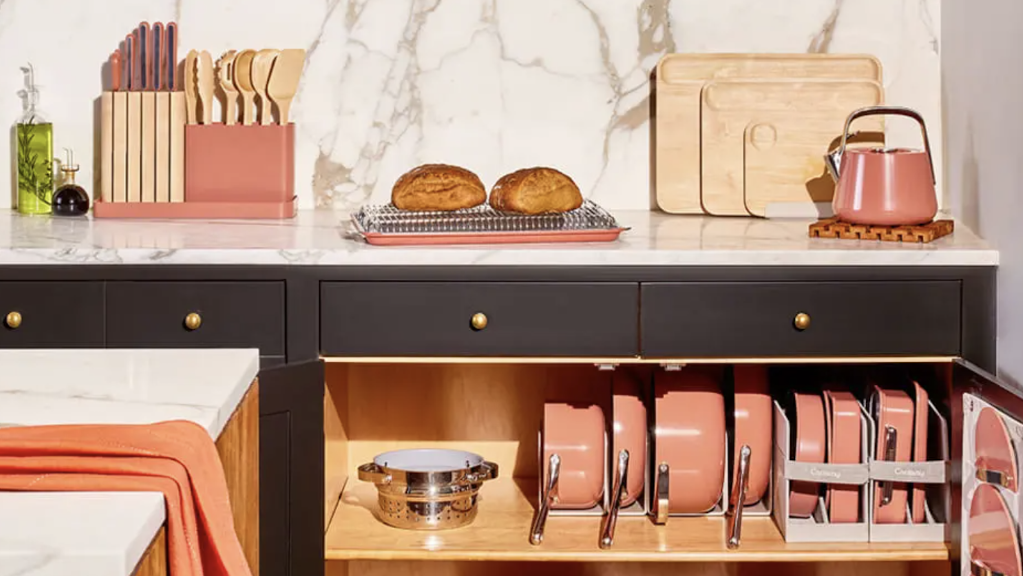 The perfect kitchen featuring Caraway Home cookware and bakeware.