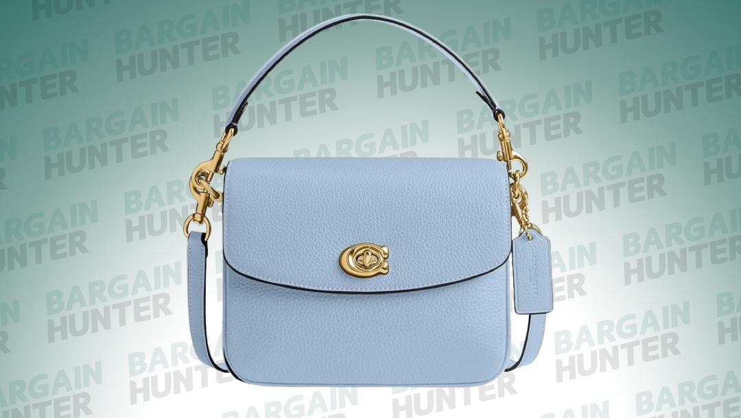 Coach Cassie crossbody bag on a plain background.