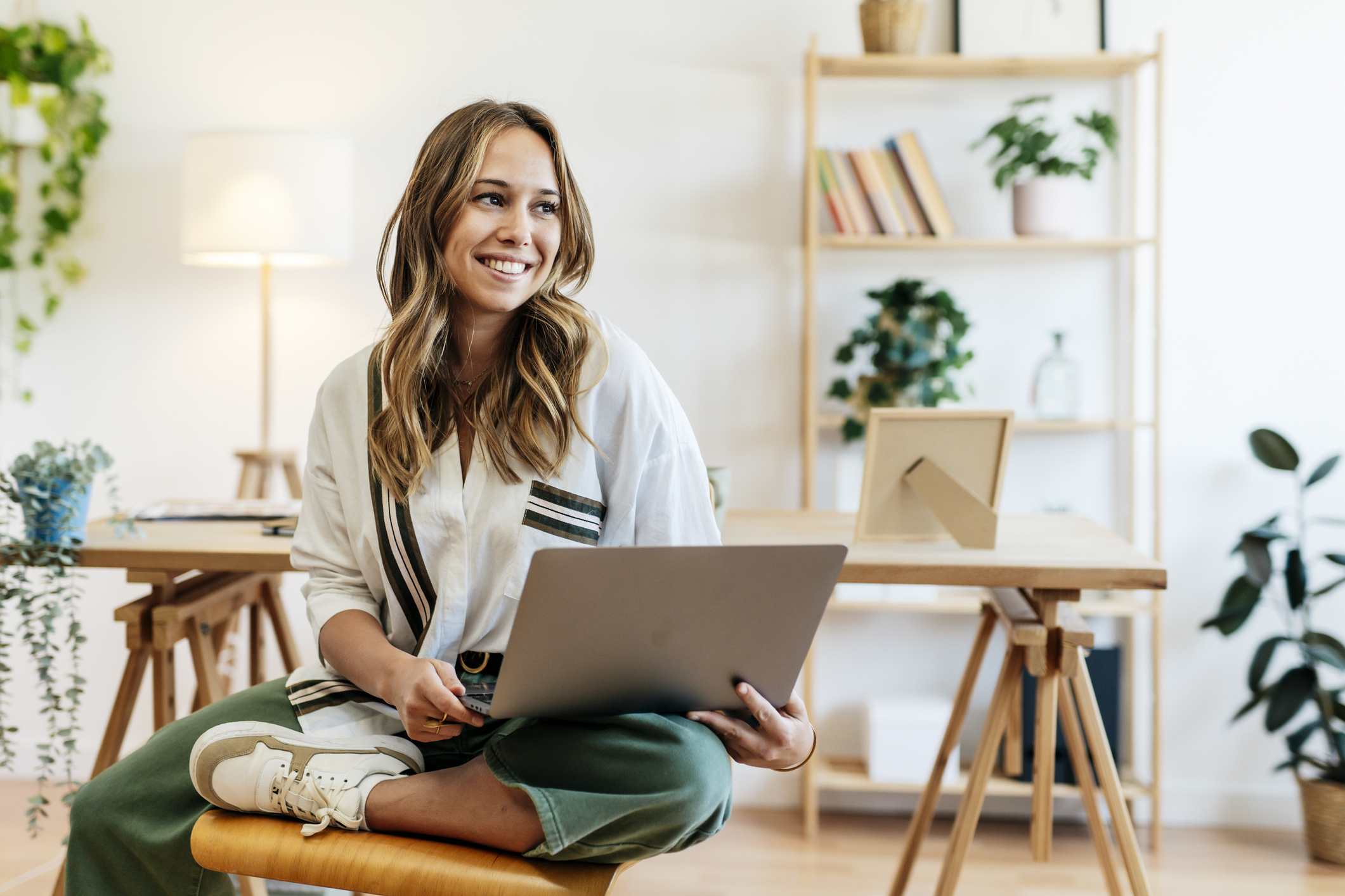 Woman with a nice smile sitting relaxed in her modern office.