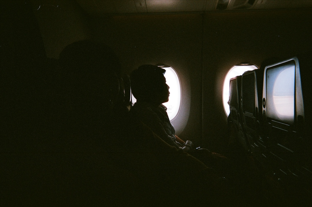 People sleeping on a plane