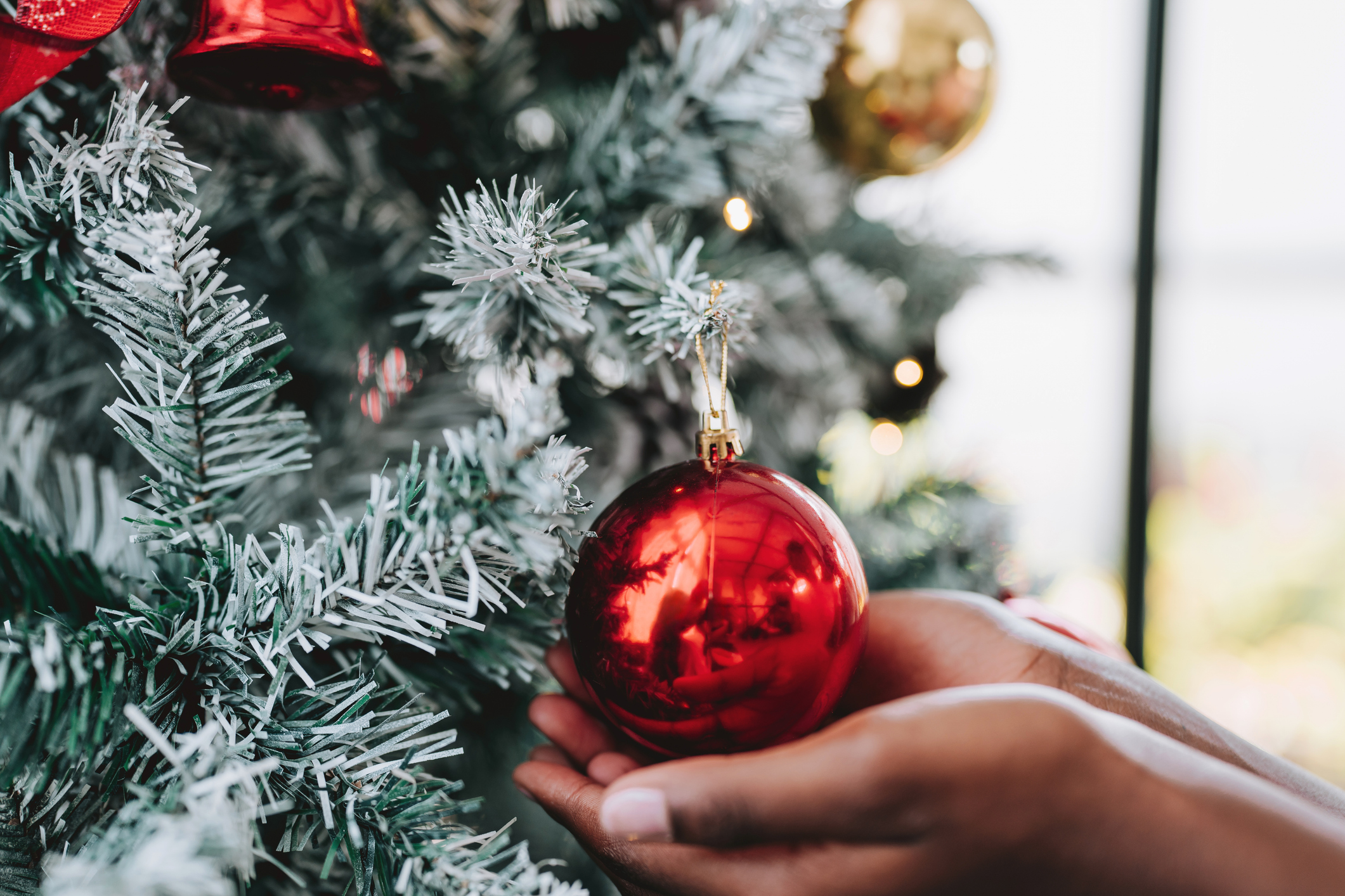 Girl decorating the Christmas tree