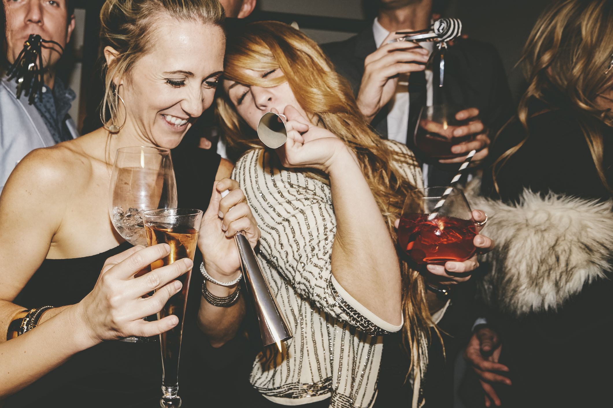 Male and female friends enjoying New Year's Eve party