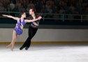 Figure skating pair skating side-by-side in the Killian Position