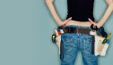 Young woman wearing tool belt