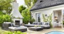 Outdoor patio area with garden furniture, swimming pool and outdoor fireplace