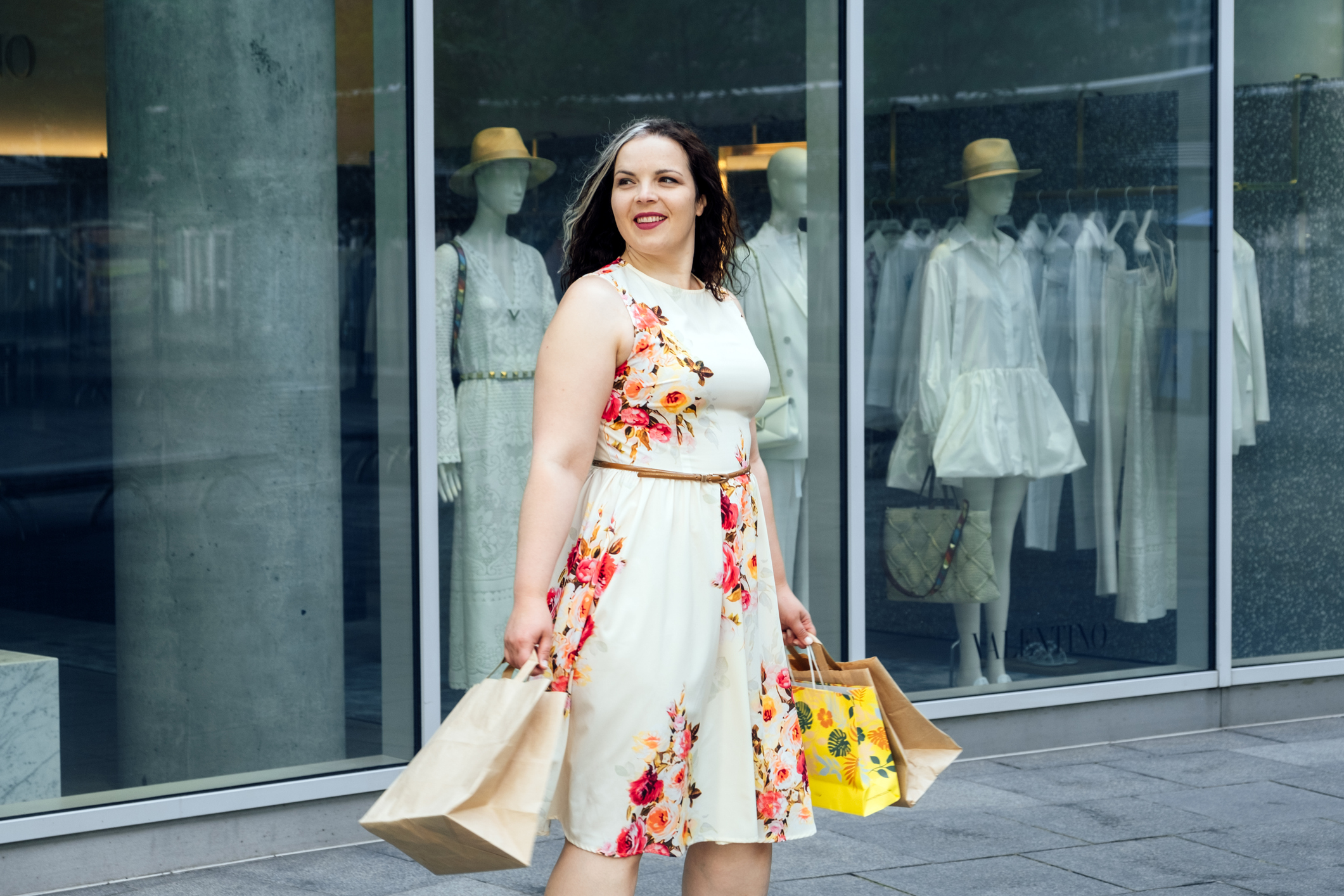 Woman wearing floral dress while shopping