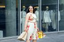 Woman wearing floral dress while shopping