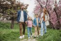 Happy young family on vacation. Parents and kids exploring European city.