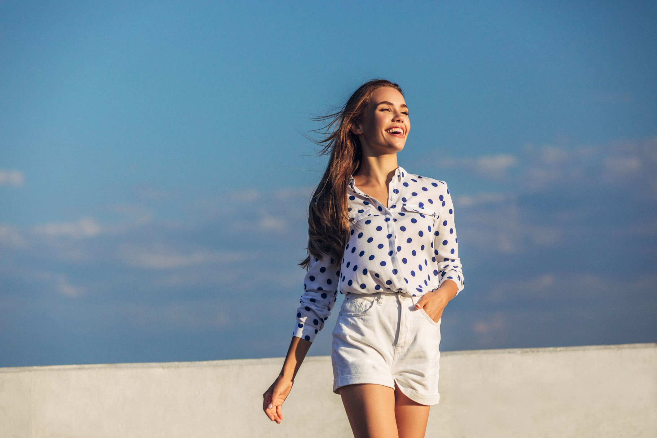woman wearing shorts with polka dotted top