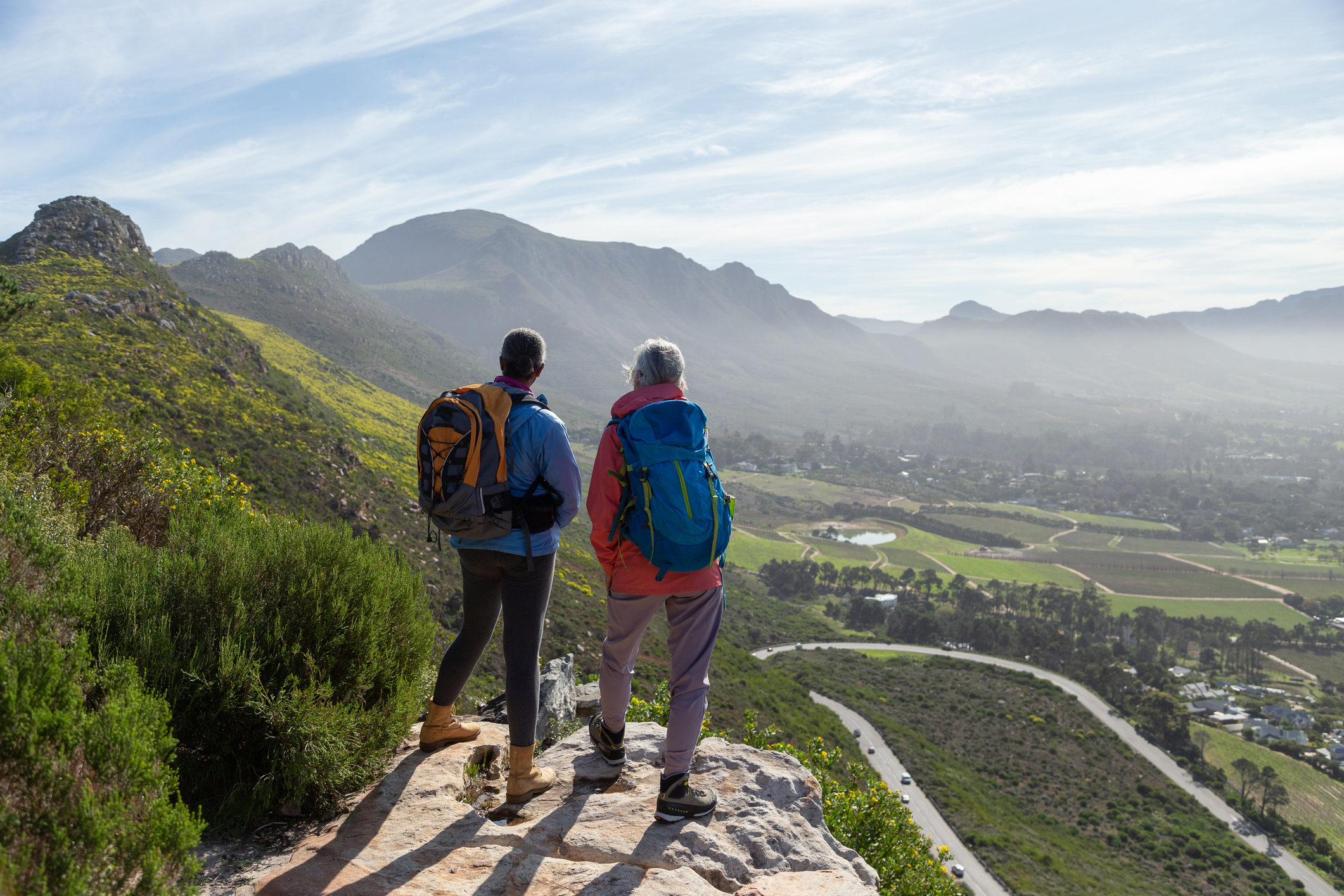 Mature female walkers resting on a mountain hike