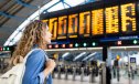 Female traveler at the airport looking at the arrival departure board