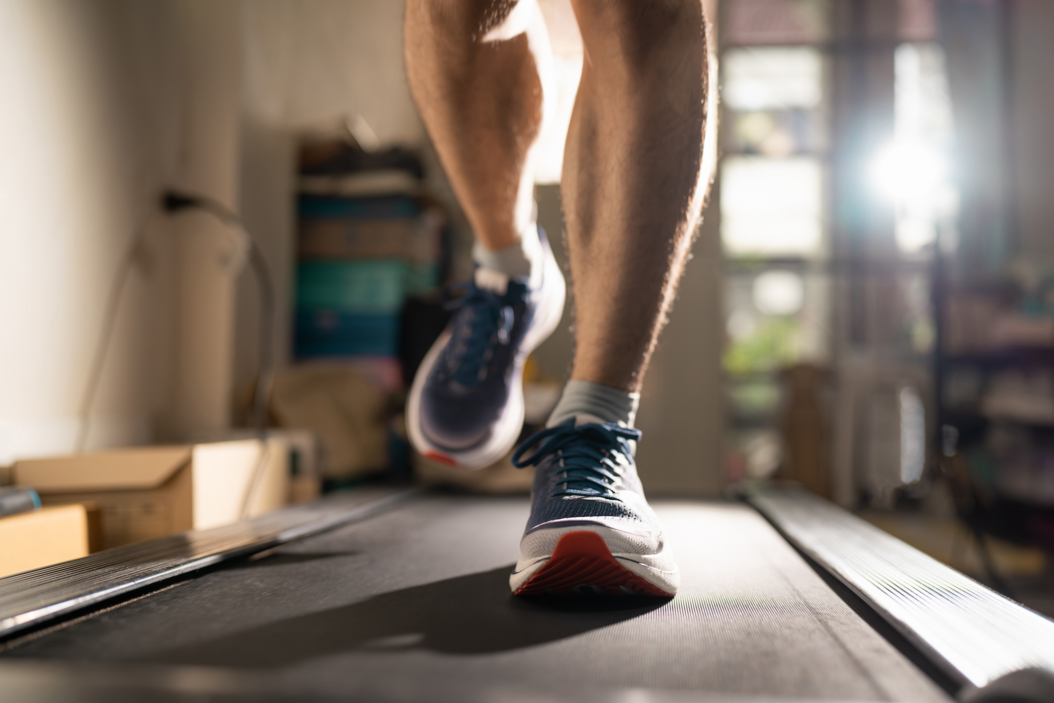 Man running on a treadmill at home