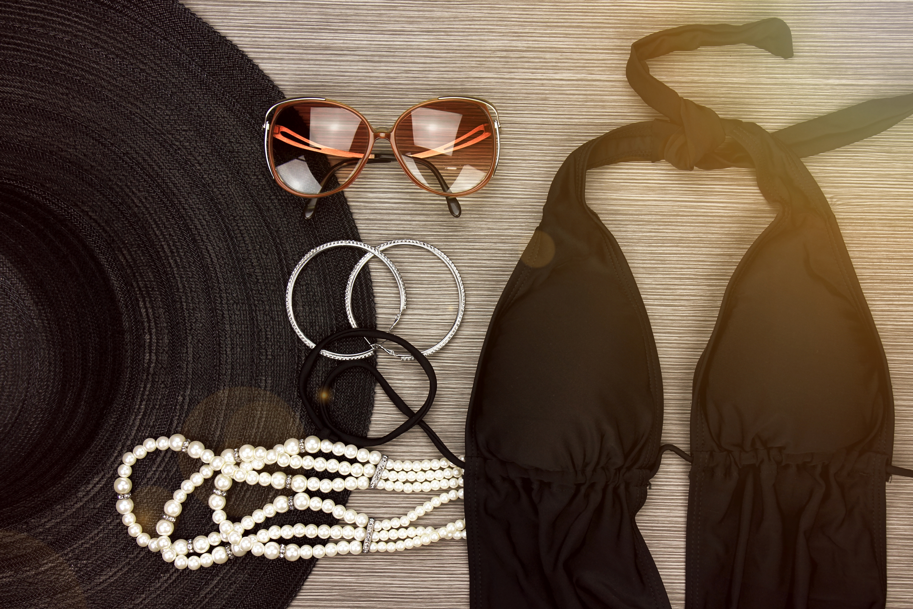 Fashion swimsuit and vintage accessories, Summer clothes, swimwear, sunglasses, earrings, necklace and wide brim sun hat, Stylish luxury accessories.