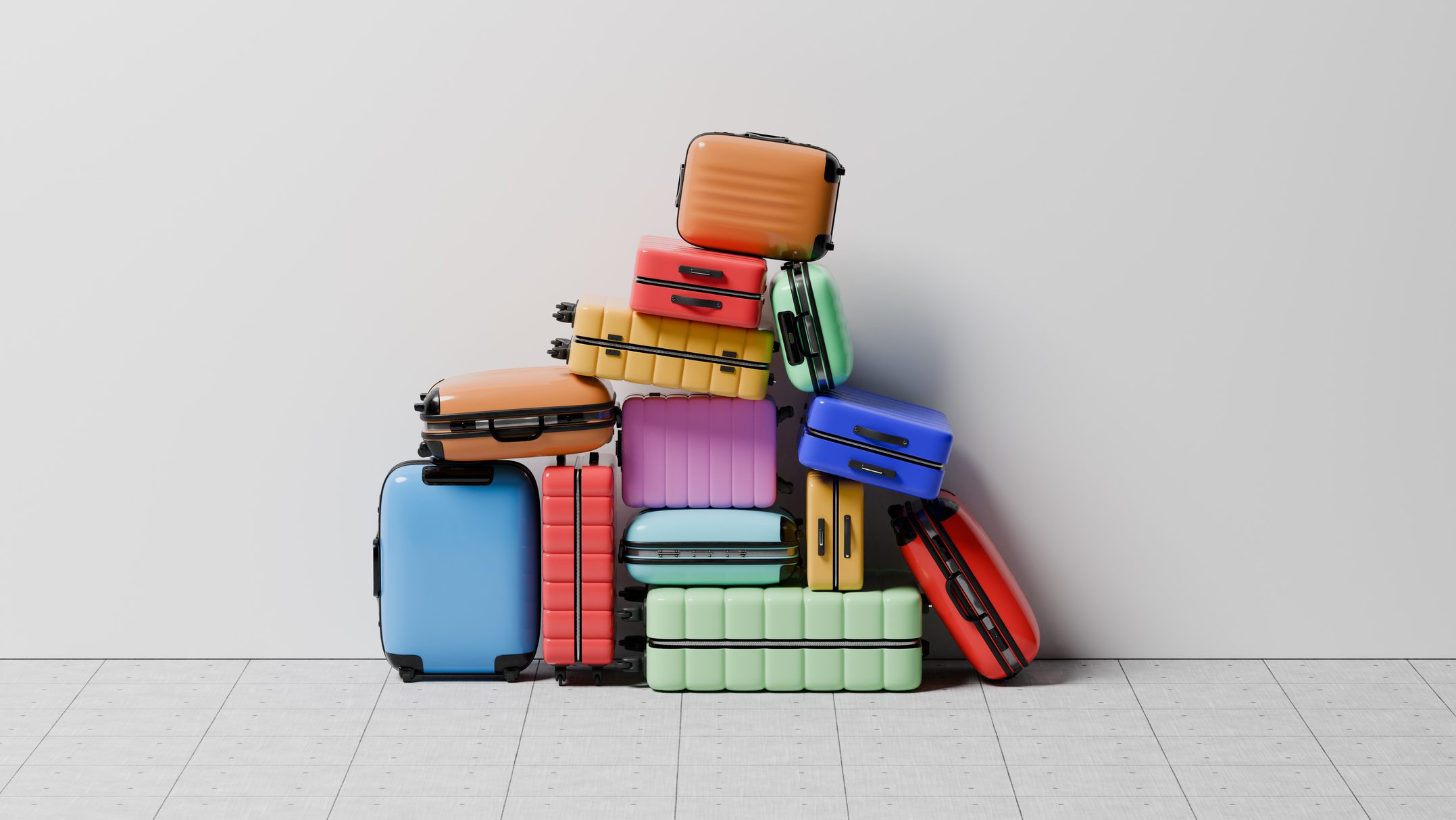 Conceptual image of a large group of luggage stacked in a pile on top of each other against a wall on a concrete tile floor