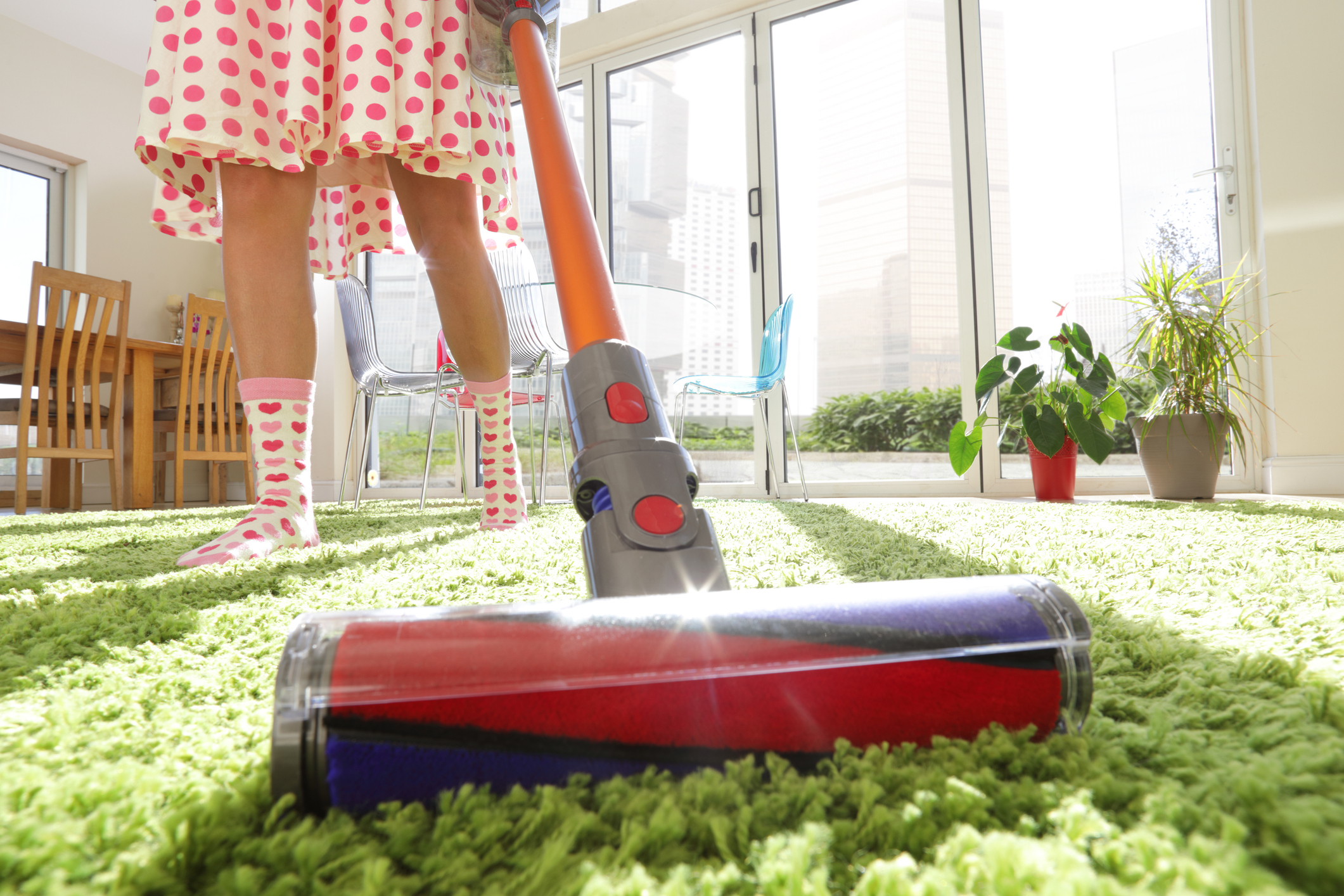 Woman Vacuuming Rug