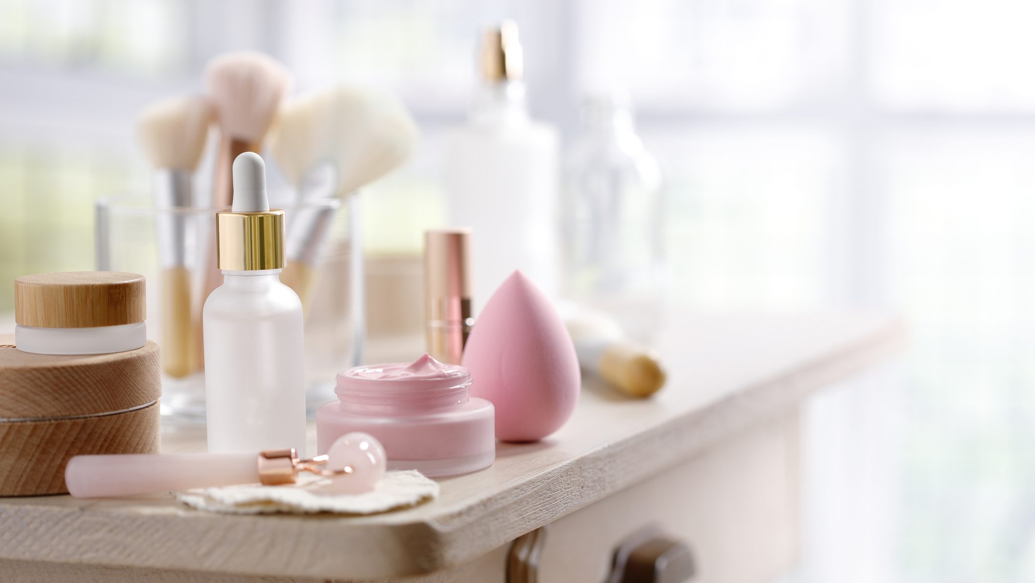 Little rustic table with skin care and make-up equipment