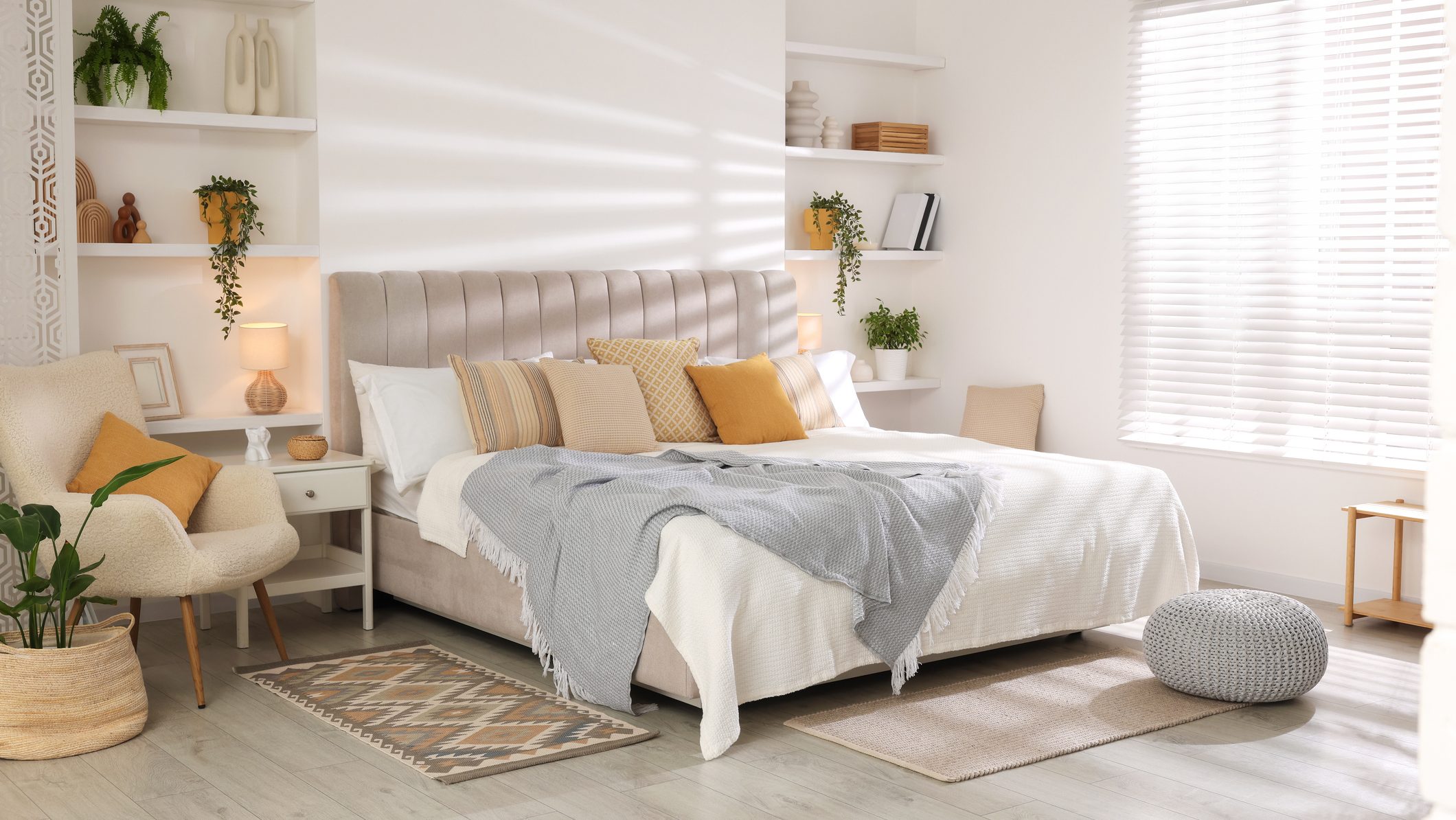 Comfortable large bed in beautiful room. Interior design