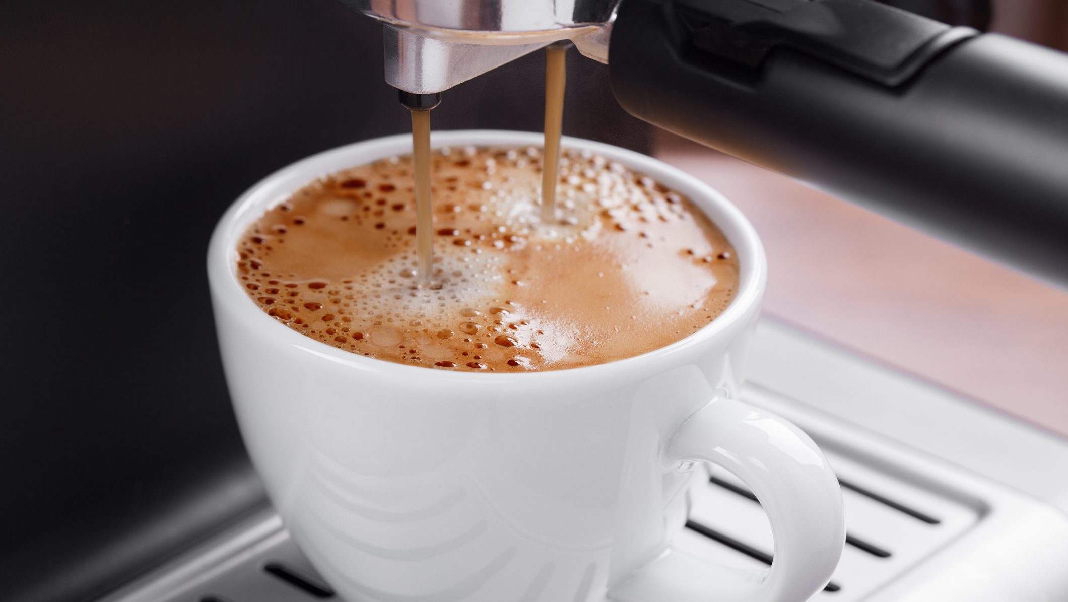 Closeup of a coffee cup in an espresso machine