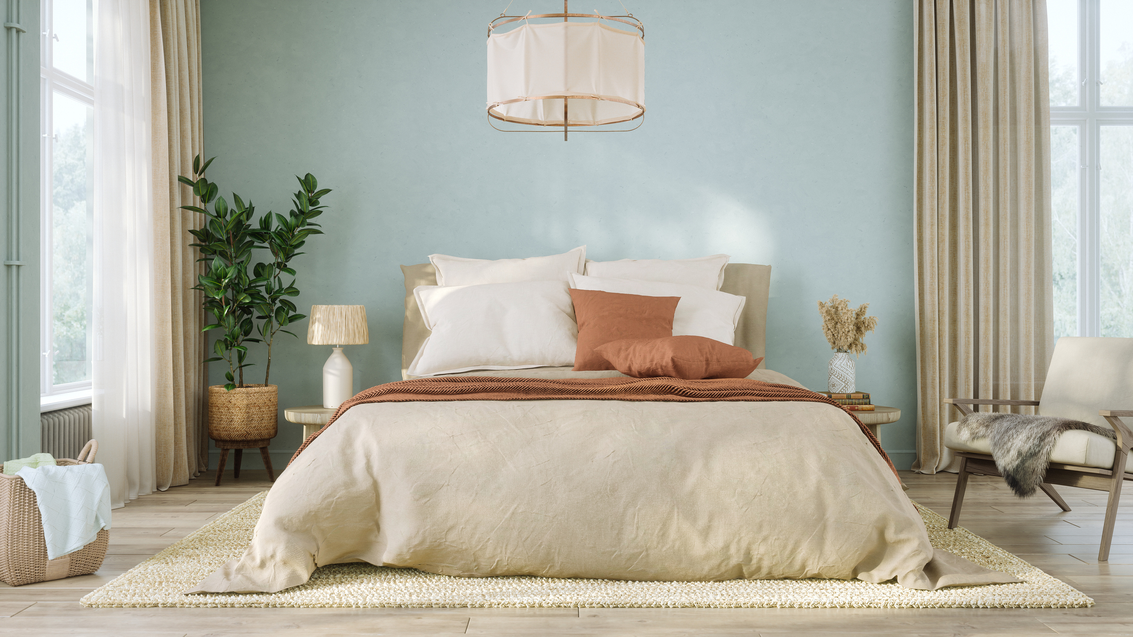 Contemporary bedroom features soft blue-green walls paired with beige linen bedding and rust-colored throw pillows. Wooden flooring, a textured area rug, and a large potted plant complement the natural aesthetic.
