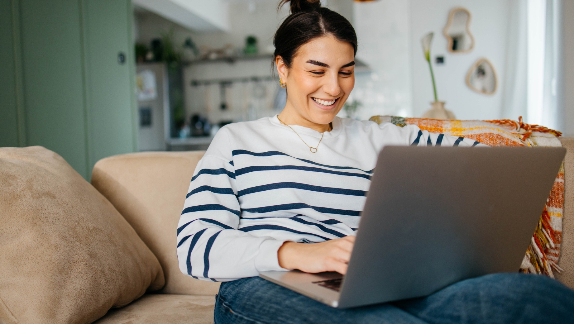 A woman using a laptop purchased when she found Amazon computer deals