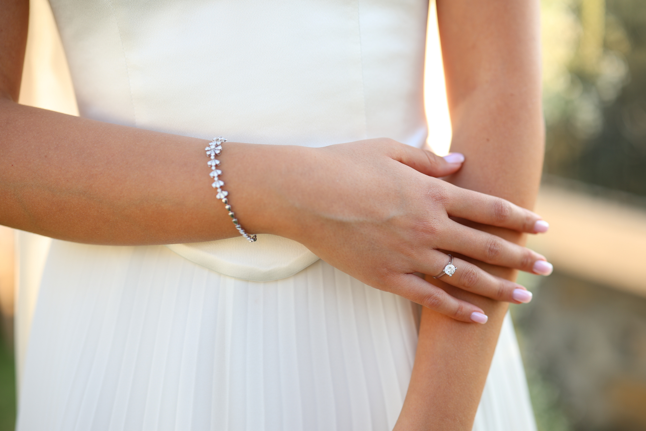 The bride holding wedding bouquet. Bright wedding bouquet in hands of the bride